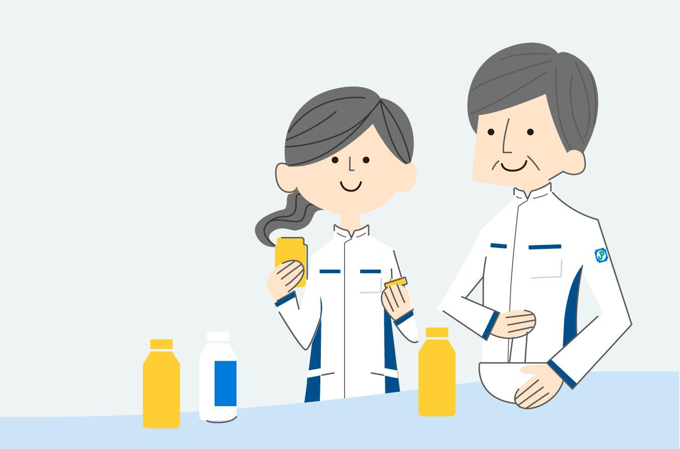 調剤を行う女性薬剤師と男性薬剤師